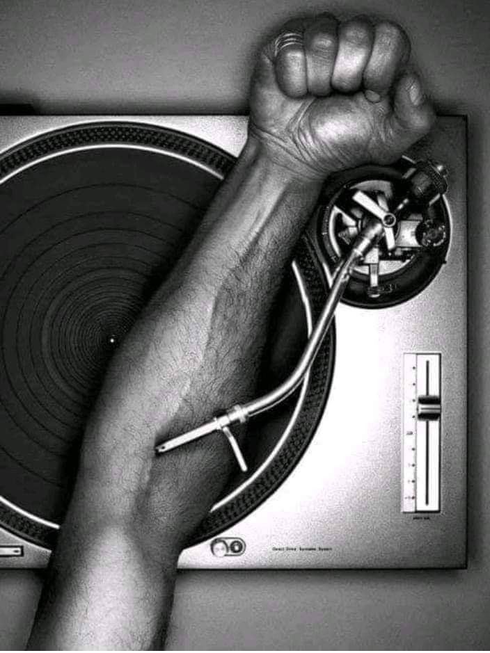 DJ turntable with fist — vinyl culture